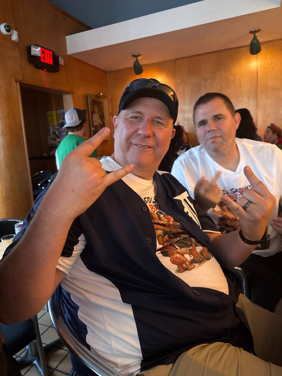 Ed throwing rock signs at his birthday
